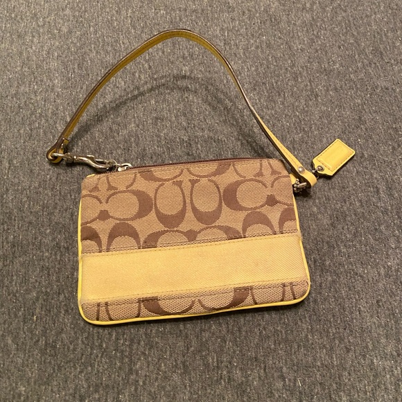 Coach Handbags - Coach yellow and tan wristlet